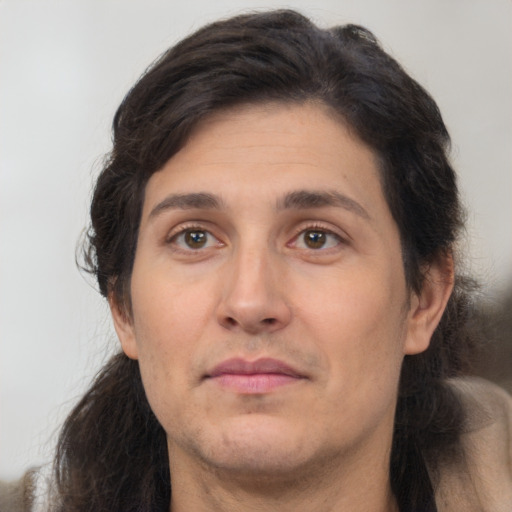 Neutral white adult male with long  brown hair and brown eyes