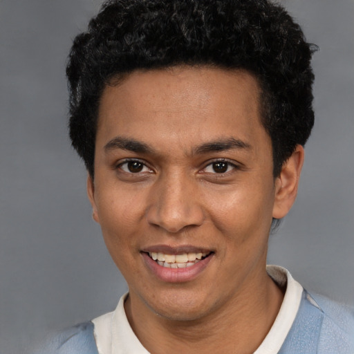 Joyful white young-adult male with short  black hair and brown eyes