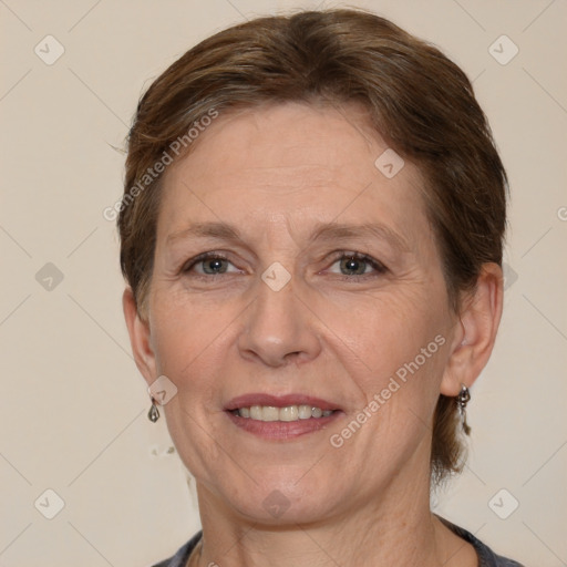 Joyful white adult female with short  brown hair and brown eyes