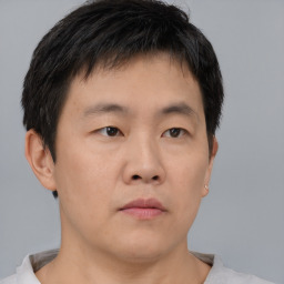 Neutral asian young-adult male with short  brown hair and brown eyes