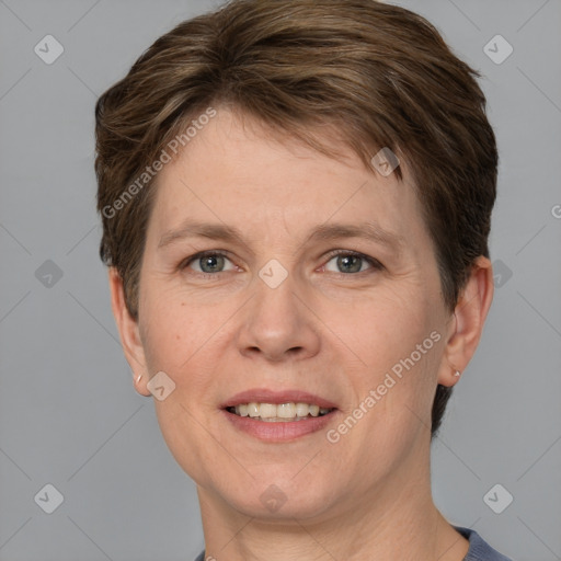 Joyful white adult female with short  brown hair and grey eyes