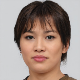 Neutral asian young-adult female with medium  brown hair and brown eyes