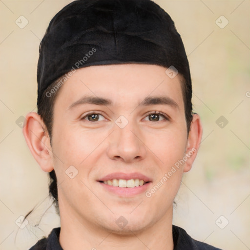 Joyful white young-adult male with short  black hair and brown eyes