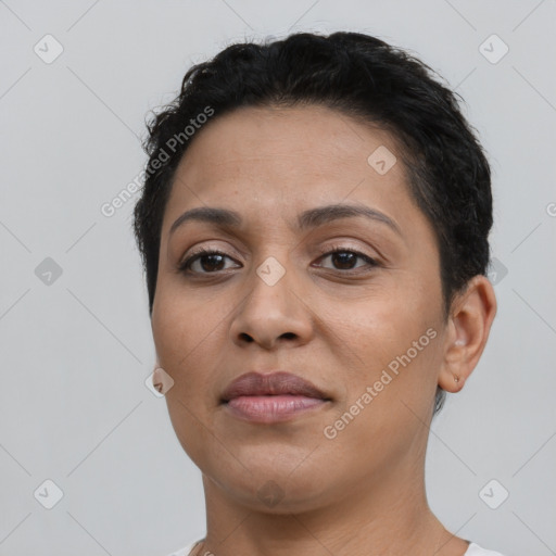 Joyful latino young-adult female with short  brown hair and brown eyes