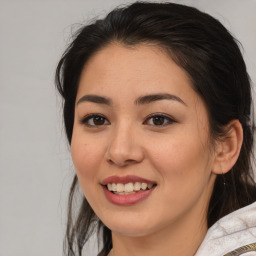 Joyful latino young-adult female with medium  brown hair and brown eyes