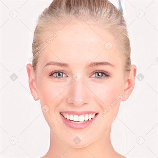 Joyful white young-adult female with short  brown hair and blue eyes