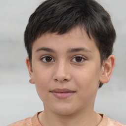 Joyful white child male with short  brown hair and brown eyes