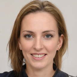 Joyful white young-adult female with medium  brown hair and grey eyes