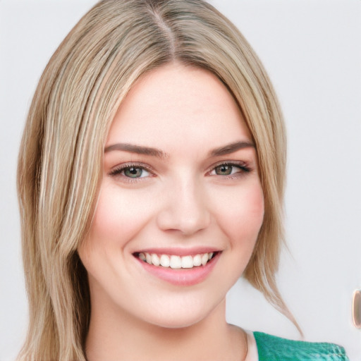 Joyful white young-adult female with long  brown hair and blue eyes