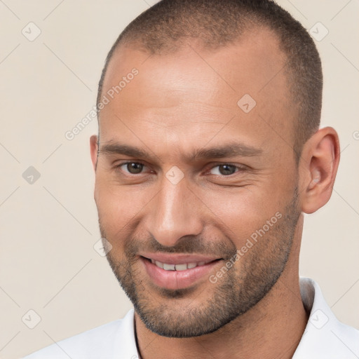 Joyful white young-adult male with short  brown hair and brown eyes