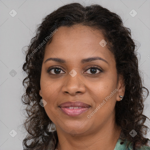 Joyful black young-adult female with long  brown hair and brown eyes