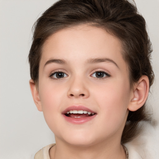 Joyful white child female with medium  brown hair and brown eyes