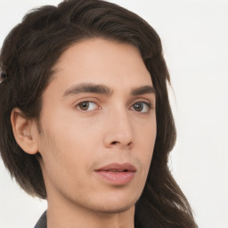 Neutral white young-adult male with long  brown hair and brown eyes