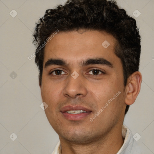 Joyful white young-adult male with short  black hair and brown eyes