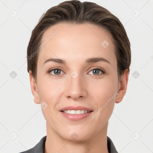 Joyful white young-adult female with short  brown hair and grey eyes