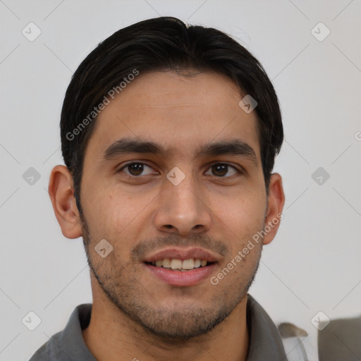 Joyful latino young-adult male with short  brown hair and brown eyes