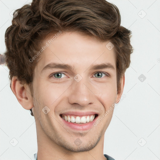 Joyful white young-adult male with short  brown hair and blue eyes