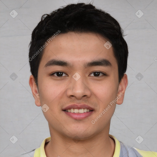 Joyful asian young-adult male with short  black hair and brown eyes