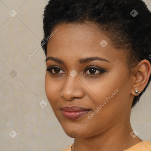 Joyful black young-adult female with short  brown hair and brown eyes