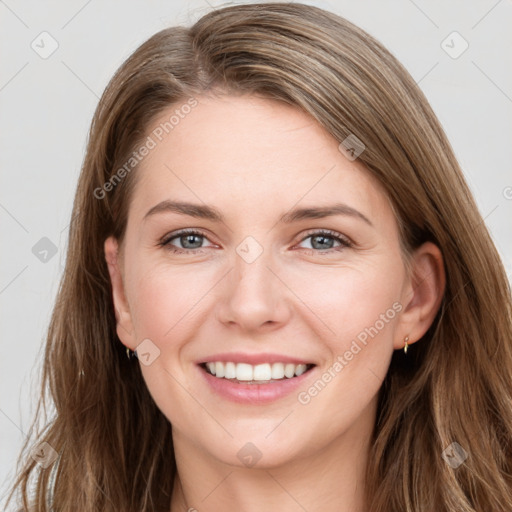 Joyful white young-adult female with long  brown hair and grey eyes