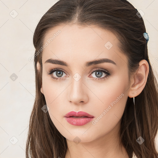 Neutral white young-adult female with long  brown hair and brown eyes