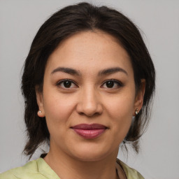 Joyful white young-adult female with medium  brown hair and brown eyes