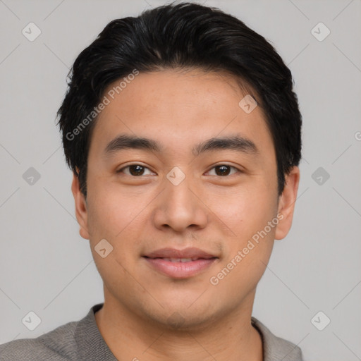 Joyful asian young-adult male with short  black hair and brown eyes