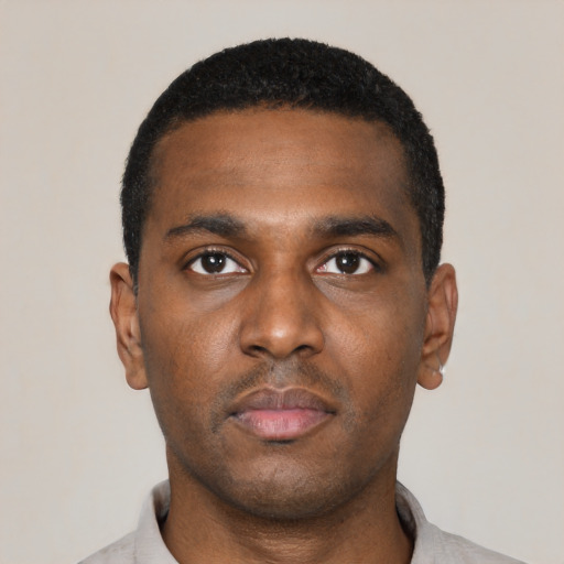 Neutral black young-adult male with short  black hair and brown eyes