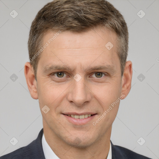 Joyful white adult male with short  brown hair and brown eyes