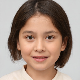 Joyful white child female with medium  brown hair and brown eyes