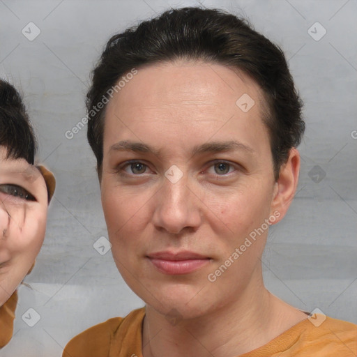 Joyful white adult female with short  brown hair and brown eyes