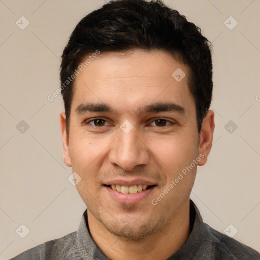 Joyful white young-adult male with short  black hair and brown eyes