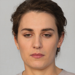 Neutral white young-adult female with short  brown hair and brown eyes