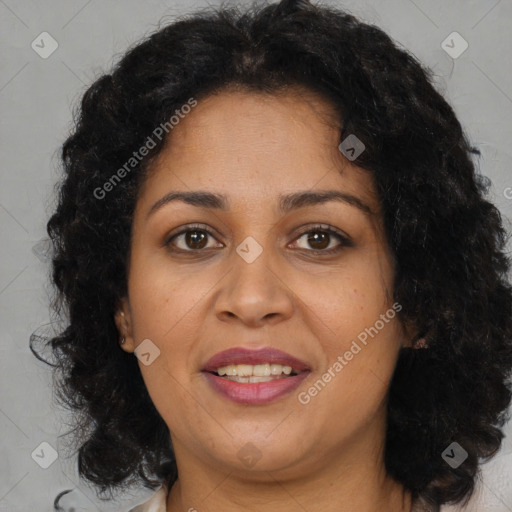 Joyful latino adult female with medium  brown hair and brown eyes