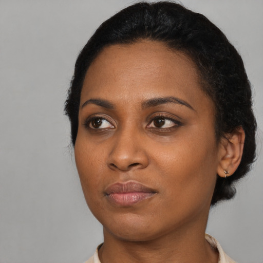 Neutral black young-adult female with short  black hair and brown eyes