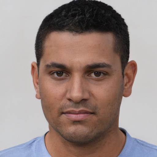 Neutral latino young-adult male with short  black hair and brown eyes