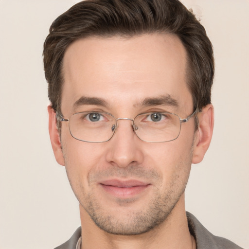 Joyful white adult male with short  brown hair and brown eyes