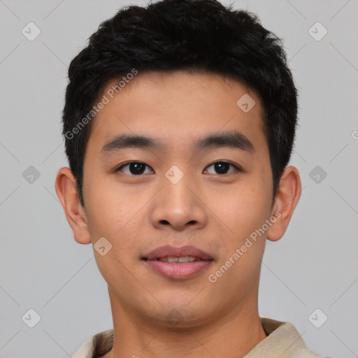 Joyful asian young-adult male with short  black hair and brown eyes