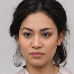 Joyful asian young-adult female with medium  brown hair and brown eyes