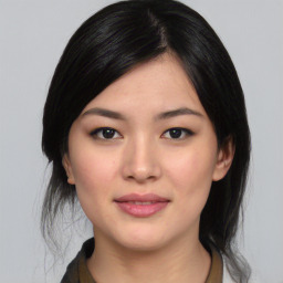 Joyful asian young-adult female with medium  black hair and brown eyes