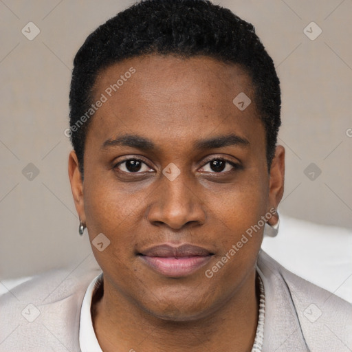 Joyful black young-adult male with short  black hair and brown eyes