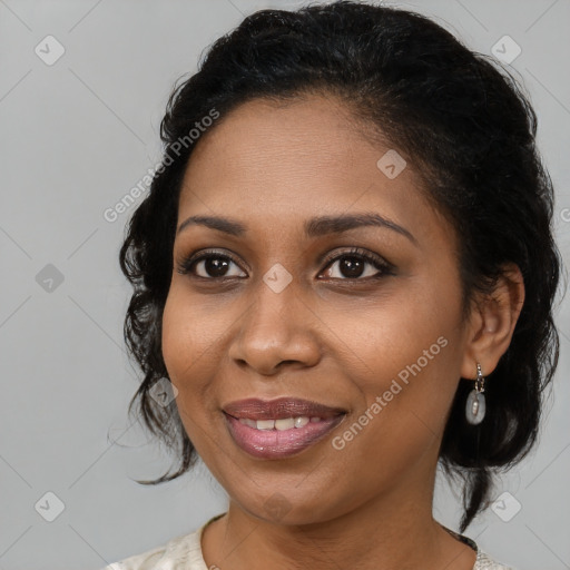 Joyful black young-adult female with medium  brown hair and brown eyes