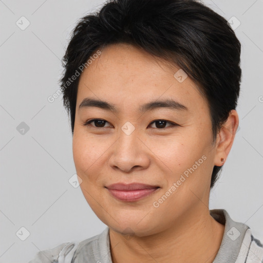 Joyful asian young-adult female with short  brown hair and brown eyes