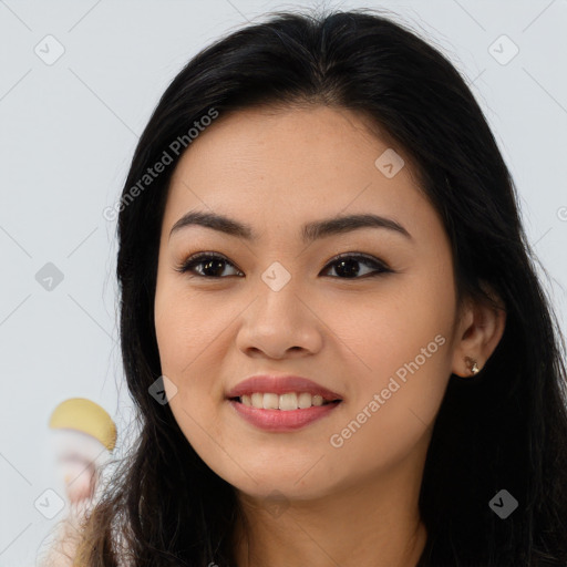 Joyful latino young-adult female with long  brown hair and brown eyes