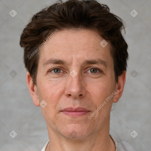 Joyful white adult male with short  brown hair and grey eyes