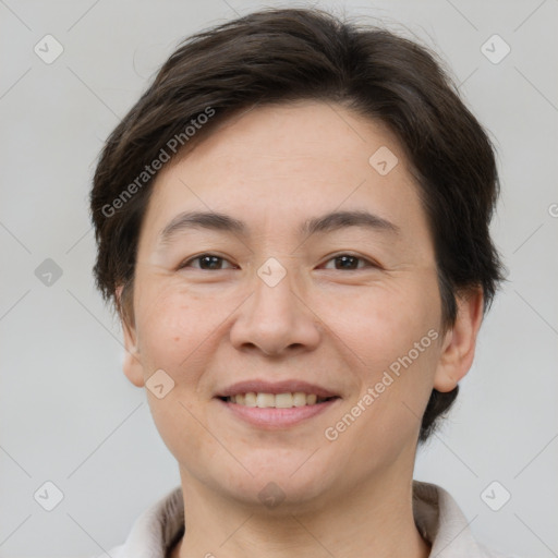 Joyful white adult female with short  brown hair and brown eyes