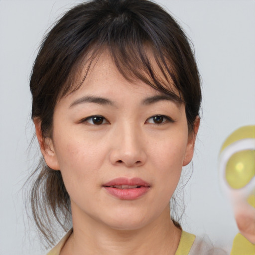 Neutral asian young-adult female with medium  brown hair and brown eyes
