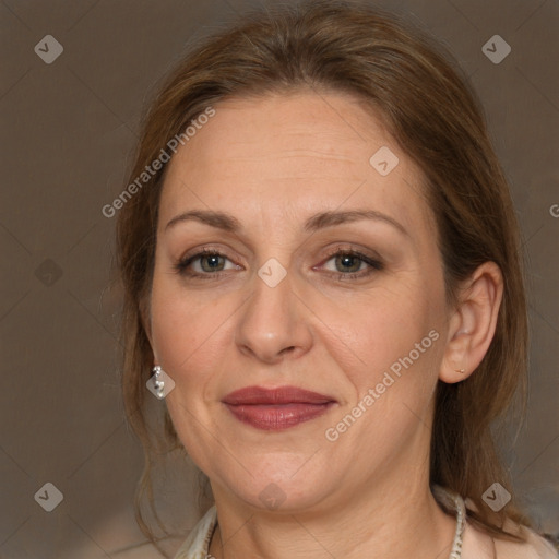 Joyful white adult female with medium  brown hair and grey eyes