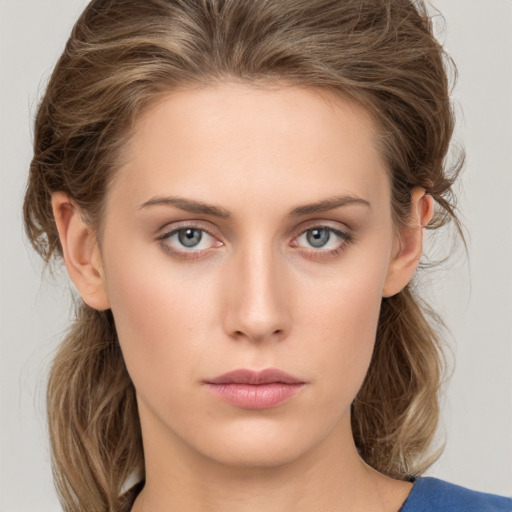 Neutral white young-adult female with medium  brown hair and blue eyes