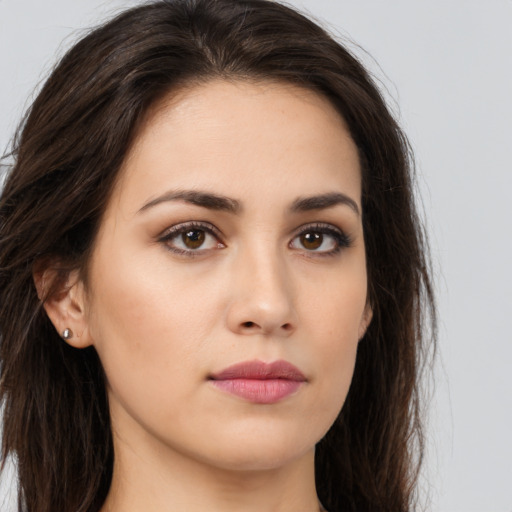 Neutral white young-adult female with long  brown hair and brown eyes